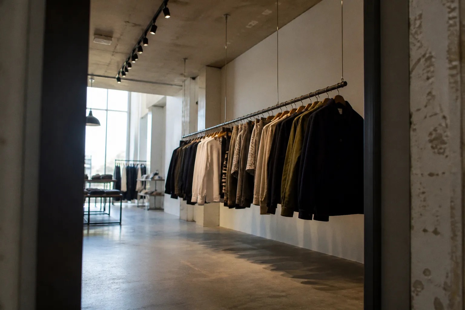 Ceiling vs Wall Garment Racks: Floor-Free Storage